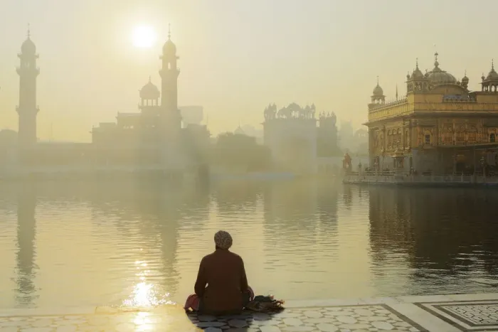 Framed Print : India, Punjab, Amritsar, a sikh pilgrim praying at the Golden Temple - the holiest