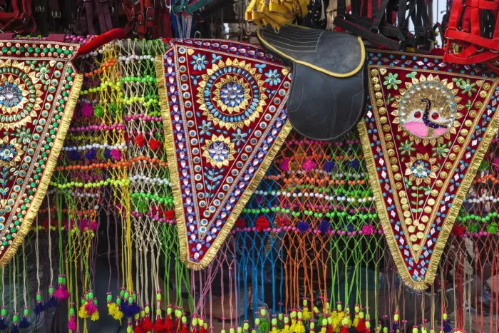 Framed Print : India, Rajasthan, Pushkar, Stall selling camel decorations and embellishments at Pushkar Framed Print : India, Rajasthan, Pushkar, Stall selling camel decorations and embellishments at Pushkar
