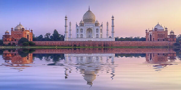India, the Taj Mahal mausoleum reflecting in the Yamuna river at sunset