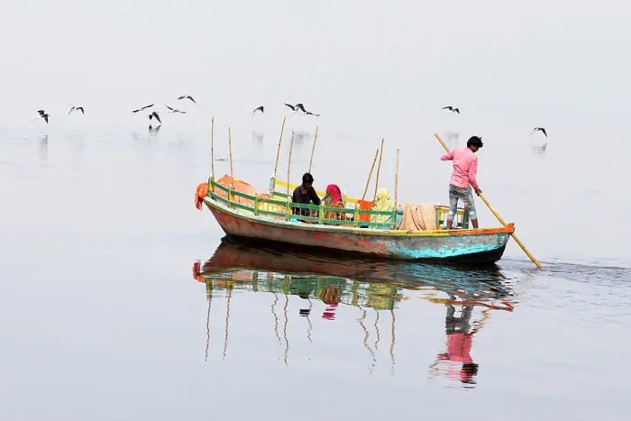 Framed Print : India, Uttar Pradesh, Mathura, Vrindavan, A ferryboat carrying passengers crosses the Yamuna river