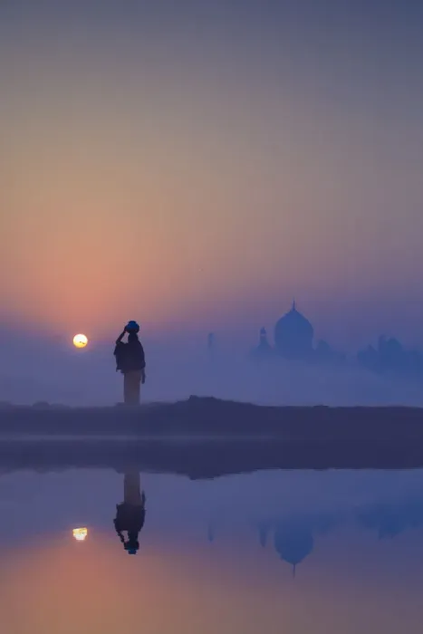 Framed Print : India, water carrying a water pot on a foggy morning with the sun rising on the Taj Mahal Framed Print : India, water carrying a water pot on a foggy morning with the sun rising on the Taj Mahal