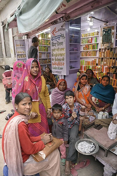 Indian family shopping at store, City of Karauli, Rajasthan, India