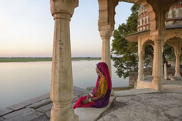Indian woman watching sunset, Village of Pachewar, Rajasthan, India, Asia