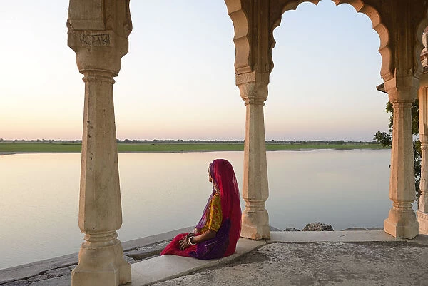 Indian woman watching sunset, Village of Pachewar, Rajasthan, India, Asia