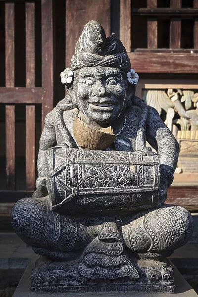 Indonesia, Bali, Tenganan Dau village. A stone statue of a spirit