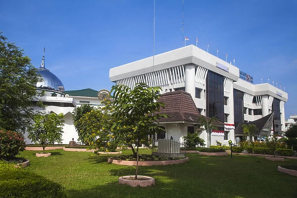 Indonesia, Sumatra, Medan, Mosque and Building next to Water Tower