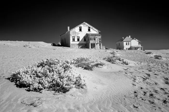 Framed Print : Infrared view of abandoned houses on sand dunes in the former diamond mining town of Kolmanskop, Luderitz, Namib Desert, Namibia Framed Print : Infrared view of abandoned houses on sand dunes in the former diamond mining town of Kolmanskop, Luderitz, Namib Desert, Namibia