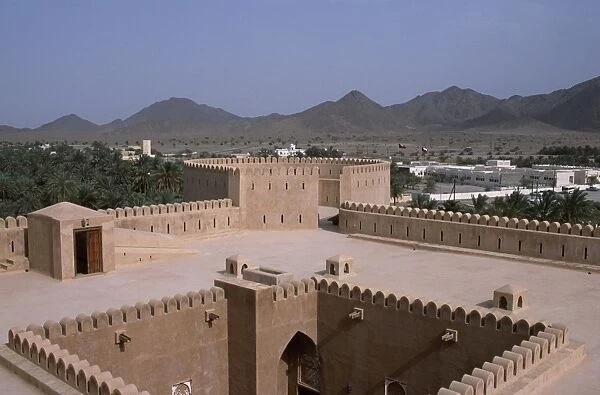 The interior courtyard and a watchtower within Al Hazm Castle