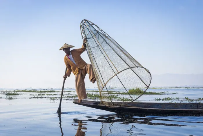 Framed Print : Intha fisherman with a traditional conical fishing net against clear sky, Lake Inle Framed Print : Intha fisherman with a traditional conical fishing net against clear sky, Lake Inle