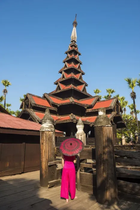 Framed Print : Inwa, Mandalay region, Myanmar (Burma). A woman with red dress and umbrella in Framed Print : Inwa, Mandalay region, Myanmar (Burma). A woman with red dress and umbrella in