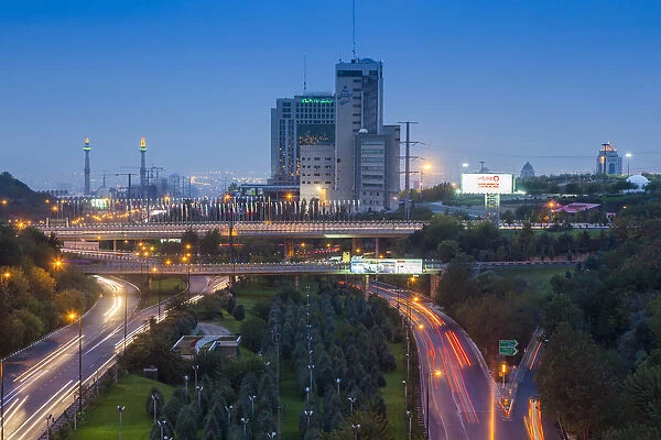 Iran, Tehran, city skyline from the Pole e Tabiat Nature Bridge, dusk
