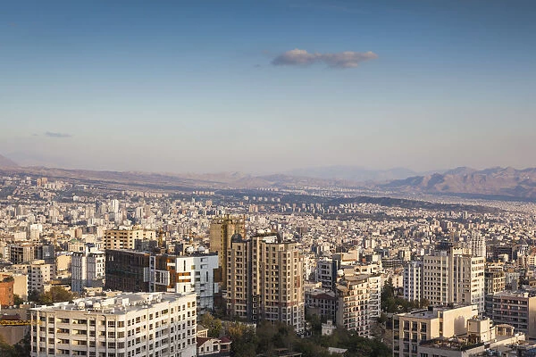 Iran, Tehran, elevated city skyline from the Roof of Iran park, sunset