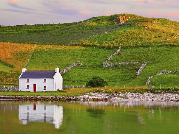 Ireland, Co. Donegal, Rosapenna, Downings, traditional Irish, cottage reflected (PR)