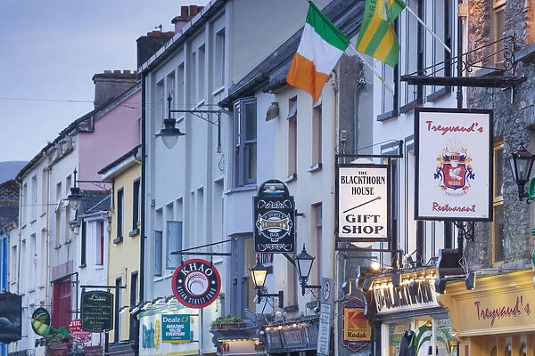 Ireland, County Kerry, Ring of Kerry, Killarney, Main Street signs, dusk