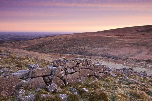 Irishmans Wall and Cosdon Hill from Belstone Common at sunrise, Dartmoor National Park, Devon, England. Winter (December) 2009