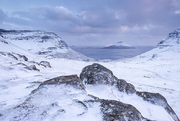 The island of Koltur from the snow covered mountains of Streymoy, Faroe Islands, Denmark