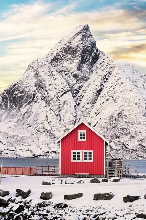 Framed Print : Isolated red fisherman cabin with snowcapped mountain on background at sunset, Sakrisoy, Reine, Lofoten Islands, Norway