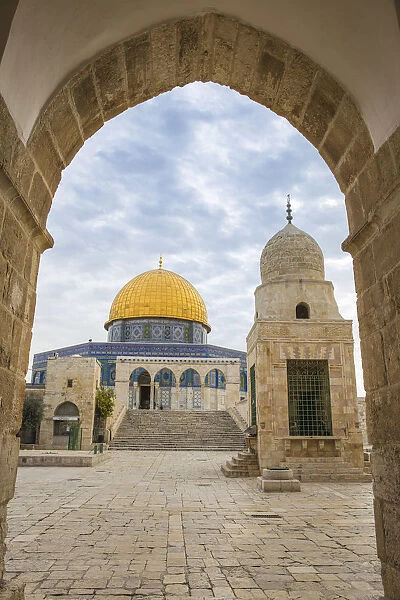 Israel, Jerusalem, Temple Mount, Man walking past Dome of the Rock and Sabil of Qairbay