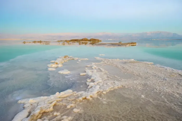 Framed Print : Israel, South District, Ein Bokek. Salt formations on the Dead Sea at sunset