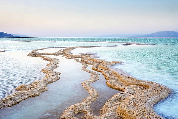 Israel, South District, Ein Bokek. Salt deposits in the Dead Sea at sunset