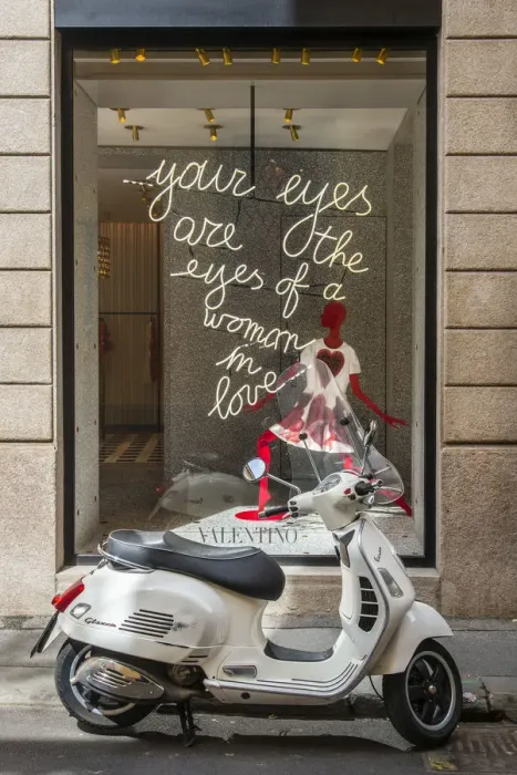 Framed Print : Italian Vespa scooter parked in Via Montenapoleone fashion street with Valentino shop Framed Print : Italian Vespa scooter parked in Via Montenapoleone fashion street with Valentino shop
