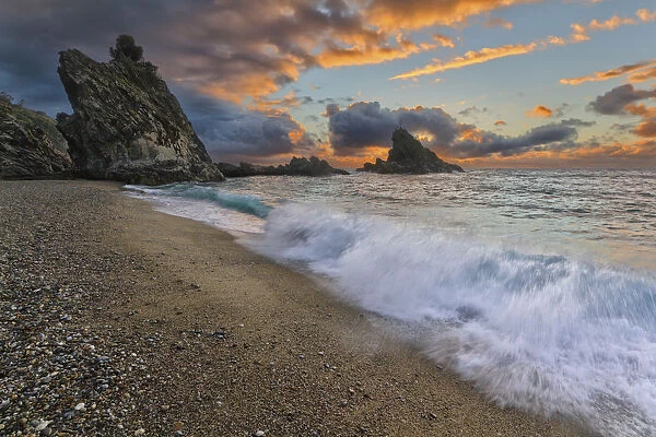 Italy, Calabria, Sunset at Ulivarella Rock