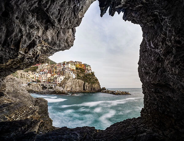 Italy, Liguria: Manarola from a cave on the shore