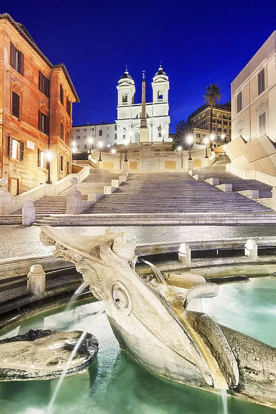 Italy, Rome, Spagna Square with Trinita dei Monti and Barcaccia fountain by night