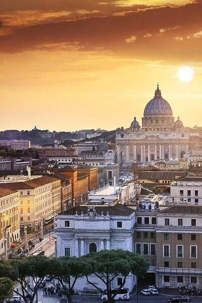 Italy, Rome, St. Peter Basilica and Via della Conciliazione elevated view at sunset