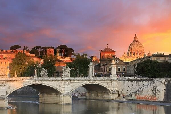 Italy, Rome, St. Peter Basilica at sunrise reflecting on Tevere river