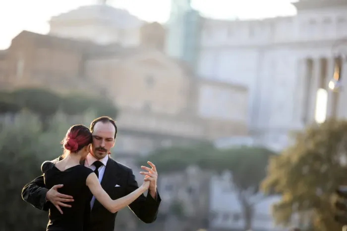Framed Print : Italy, Rome, tango dancers at Roman Forum with Altare della Patria in the background