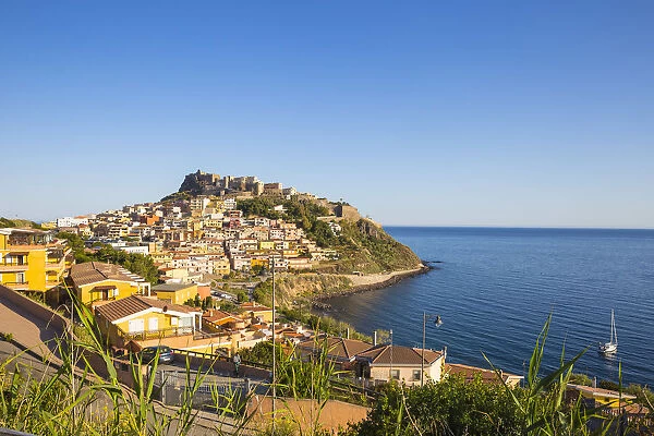 Italy, Sardinia, Sassari Province, Castelsardo, View over marina towards ancient castle