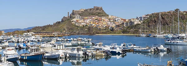 Italy, Sardinia, Sassari Province, Castelsardo, View over marina towards ancient castle
