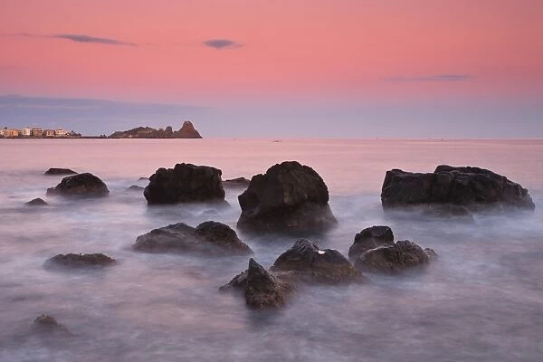 Italy, Sicilia, Sicily, Last light at dusk, in the background the Cyclopes stacks
