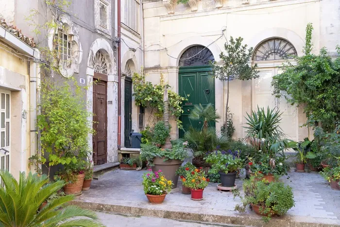 Framed Print : Italy, Sicily, Ragusa, a courtyard full of colourful plants and flowers in Ragusa Ibla Framed Print : Italy, Sicily, Ragusa, a courtyard full of colourful plants and flowers in Ragusa Ibla