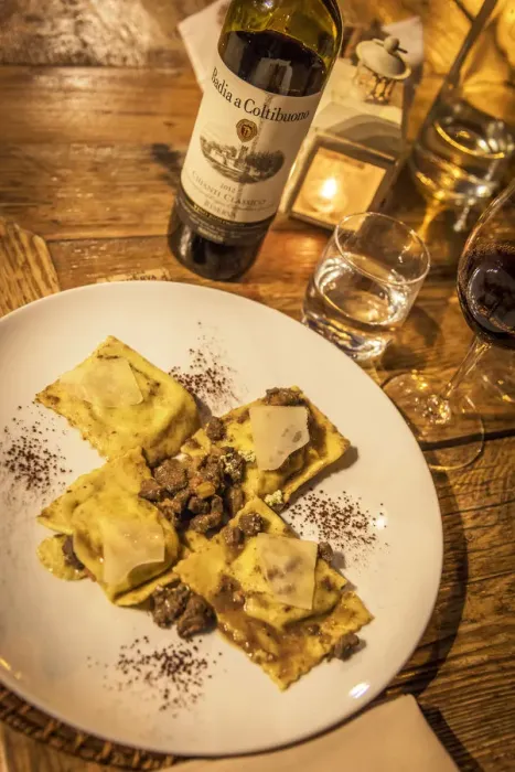 Framed Print : Italy, Tuscany, candle light dinner with ravioli and chianti wine in Suvereto
