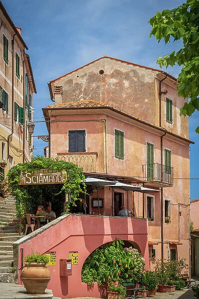 Italy, Tuscany, Elba. A restaurant in the picturesque streets of Poggio, little village in Western Elba