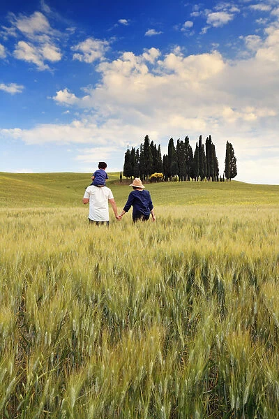 Italy, Tuscany, Siena district, Orcia Valley, Family takes a walk in the countryside