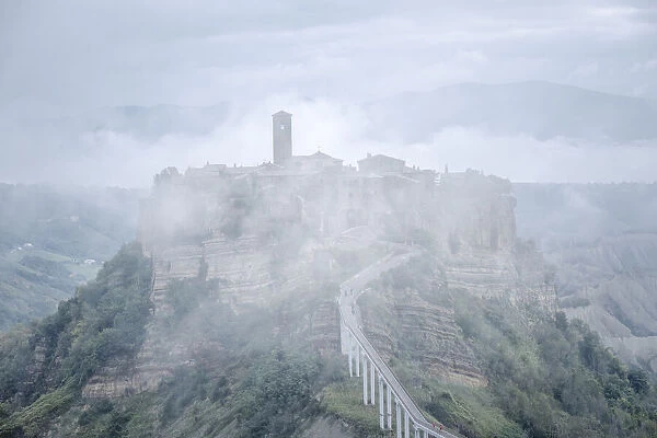 Italy, Umbria: morning fog on Civita di Bagnoregio