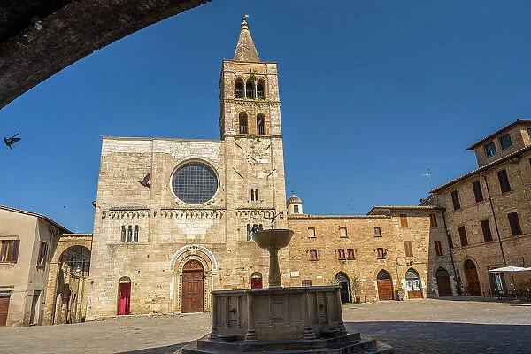 Italy, Umbria. The piazza of the main church of Bevagna with the fountain