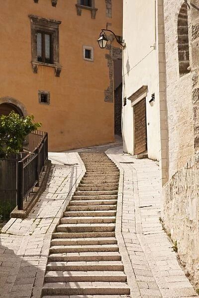 Italy, Umbria, Preci. A narrow street in Preci, known throughout Europe in the sixteenth century for its school for surgeons, founded by Benedictine monks, their main trade being the removal of kidney stones, eye surgery