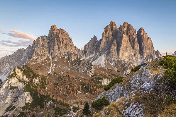 Italy, Veneto, Belluno district, Auronzo di Cadore, a hiker taking photographs of the Cadini