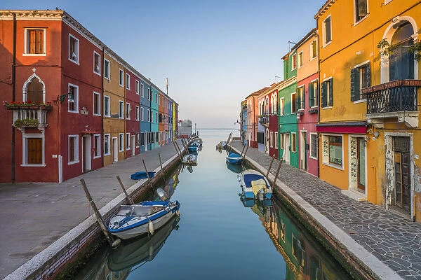 Italy, Veneto, Venice, Burano island, the sun rises on the typical colored houses