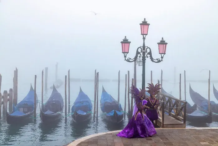Framed Print : Italy, Veneto, Venice, a couple pose in costume during the Venice Carnival on a foggy day Framed Print : Italy, Veneto, Venice, a couple pose in costume during the Venice Carnival on a foggy day