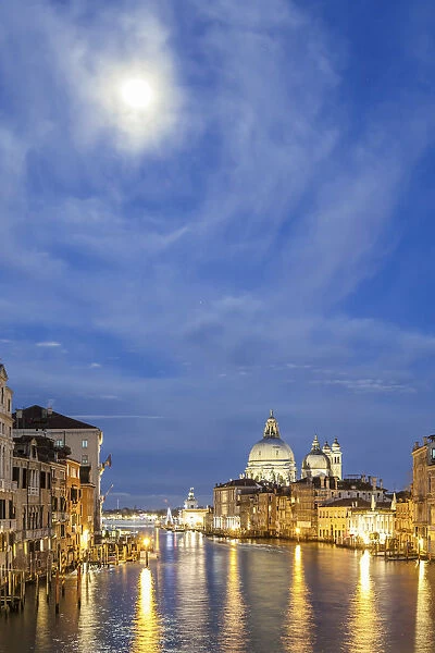 Italy, Veneto, Venice. Grand Canall and Santa Maria della Salute church with full moon