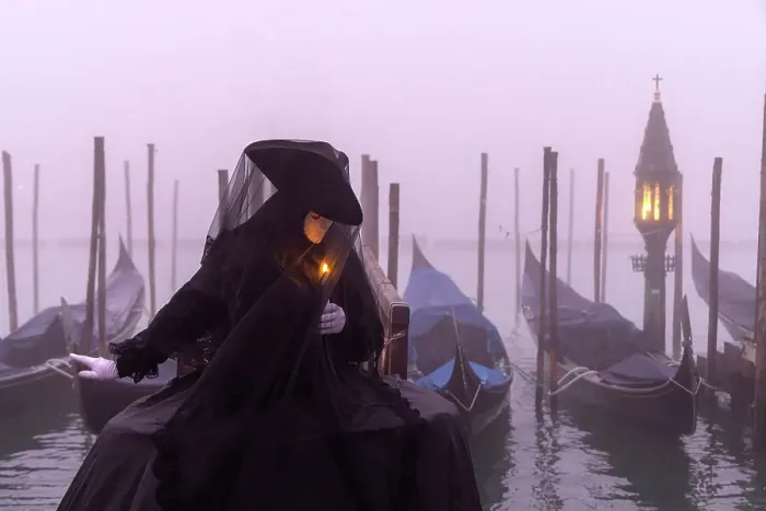 Framed Print : Italy, Veneto, Venice, a model poses in costume during the Venice Carnival on a foggy day Framed Print : Italy, Veneto, Venice, a model poses in costume during the Venice Carnival on a foggy day