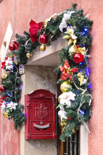 Italy, Veneto, Venice, Murano island. Door decorated for Christmas