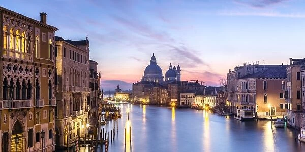 Italy, Veneto, Venice. Santa Maria della Salute church and Grand Canal at sunrise