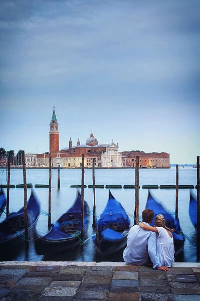 Italy, Veneto, Venice, Sestiere of San Marco, Moored gondolas with San Giorgio Maggiore
