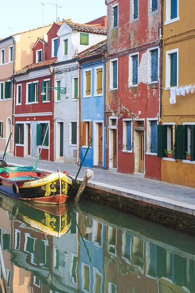 Italy, Venice, Burano. View of a canal with typical colorful houses